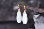 Moonstone and ruby drop earrings.